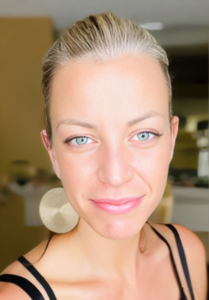 woman's face smiling with the big earrings